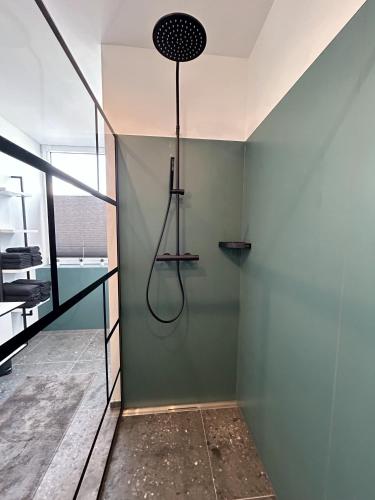 a shower in the corner of a room at Ferienwohnung Kassel City in Kassel