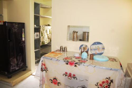 a table in a room with a table cloth at Chitrakut Bungalows in Dwarka