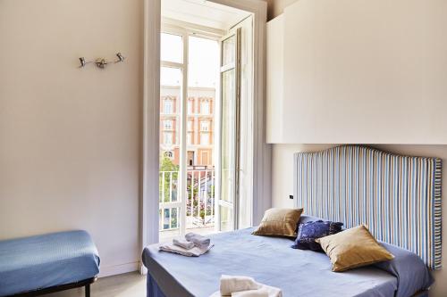 Postel nebo postele na pokoji v ubytování B&B Neapolis Bellini