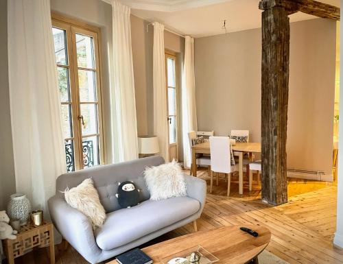 a living room with a couch and a table at Monappart Cristo Historic Apartment with Parking in Bilbao