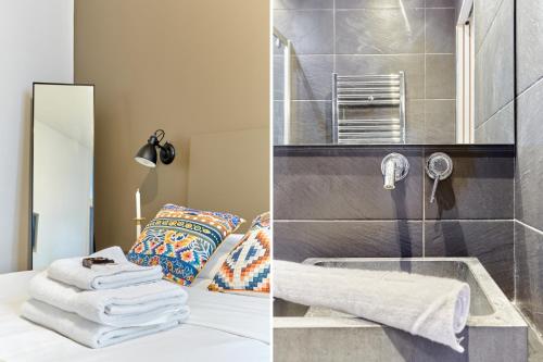 a bathroom with a sink and a bed with towels at Apartment Le Marais by Studio prestige in Paris