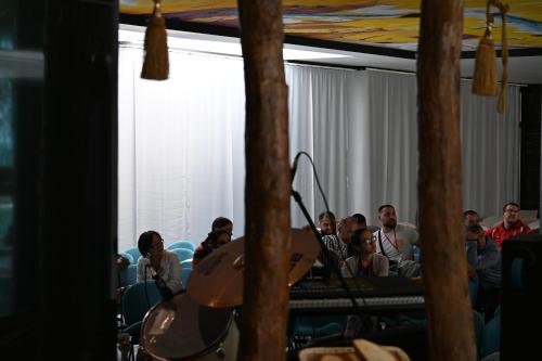 a group of people sitting in a room at Royal G Max in Golem