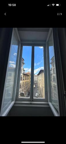 a window with a view of a city at PB suites in Florence