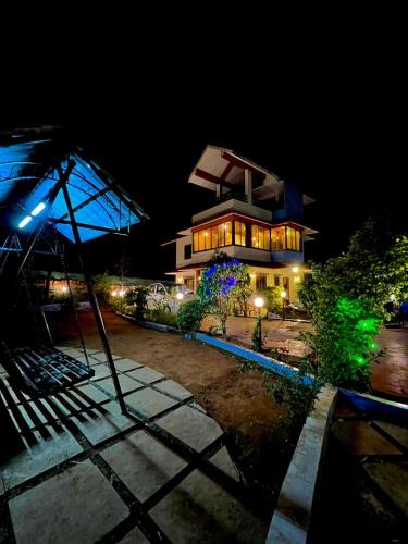 a building at night with a building at Mount View Villa - The Dream Stays ll Pvt Pool ll Garden ll 3Ac rooms in Lonavala