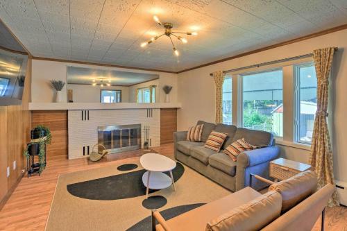 a living room with a couch and a fireplace at Parkstrip Place, Pet Friendly Downtown Home in Anchorage