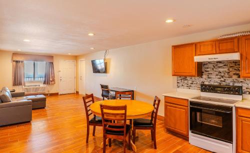 a kitchen and living room with a table and chairs at Quality Inn Rockport on Aransas Bay in Rockport