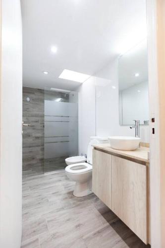 a bathroom with two sinks and a toilet and a shower at Casa Wineland Logde West 4Pax - by Inside in Ciudad Lujan de Cuyo