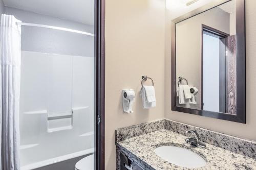 a bathroom with a sink and a mirror at Super 8 by Wyndham Richfield UT in Richfield