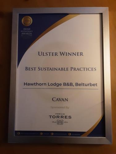 a framed sign for the united winner of the best sustainable practicesigham lodge barber at Hawthorn Lodge in Belturbet