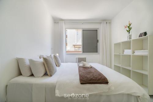 A bed or beds in a room at Apto no Open Shopping Jurerê internacional SBS106