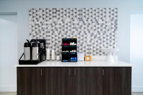 a counter in a room with a wall at La Quinta Inn Birmingham - Inverness in Birmingham