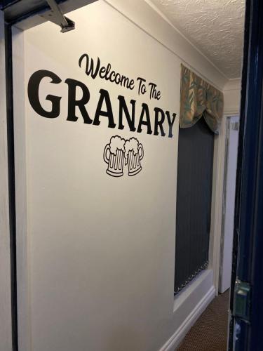 a welcome to the ceremony sign on a wall at The Granary Bar & Grill in Long Sutton