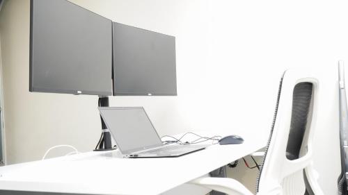 a white desk with a laptop and a computer monitor at Hamilton Hospital Retreat - 2 Bedroom Townhouse Modern Warm Quiet in Hamilton