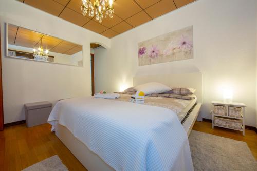 Postel nebo postele na pokoji v ubytování Chiara's Home - Happy Rentals