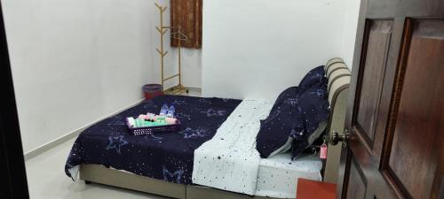 Ένα ή περισσότερα κρεβάτια σε δωμάτιο στο Ankanghomestay