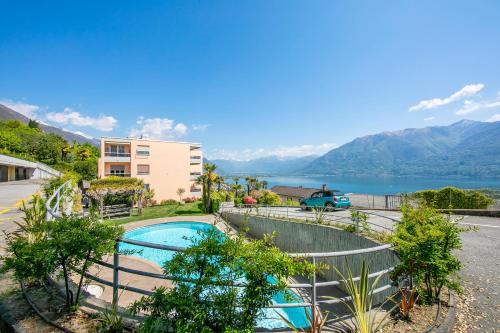 a house with a swimming pool with a view of a lake at Casa Monti Belvedere in Locarno