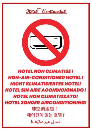a sign with a no smoking sign next to words at Hôtel Continental in Évian-les-Bains