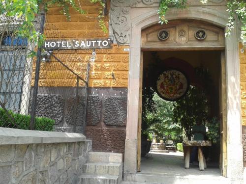 a hotel santinia sign on the side of a building at Hotel Sautto in San Miguel de Allende