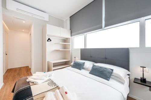 Giường trong phòng chung tại BnButler - InBrera Suites - Giulianova, 1