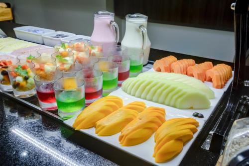 a table topped with different types of food and drinks at Transamerica Fit Campinas in Campinas