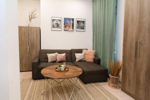 a living room with a couch and a table at Perfect place in the heart of downtown in Budapest