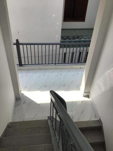 a stairway with a bench in a building at Koala1 Apartment in Vung Tau
