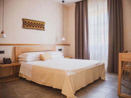 Un ou plusieurs lits dans un hébergement de l'établissement Tramas Hotel & Spa