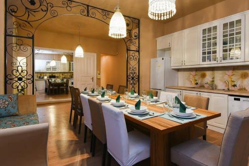 a large dining room with a long table and chairs at Very central very spacious new home in Budapest