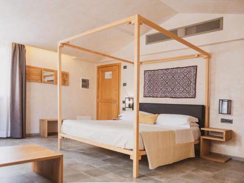 Un ou plusieurs lits dans un hébergement de l'établissement Tramas Hotel & Spa