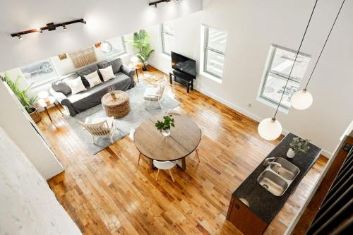 an overhead view of a living room with a table at Soaring 2BR Parkside Loft Walkable to it All in Cincinnati