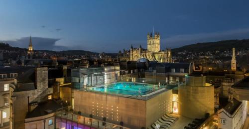 a building with a swimming pool on top of it at Seven Acres Cottage with Parking in Bath