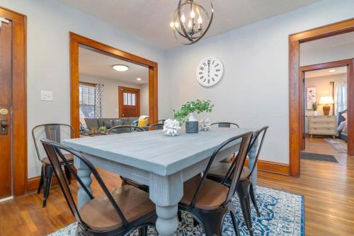 a dining room with a blue table and chairs at 3BR Bristol Retreat - 2 Blocks from State Street in Bristol