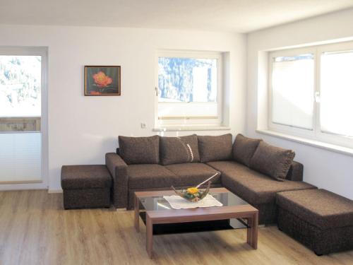 a living room with a couch and a coffee table at Apartment Stefan-1 by Interhome in Hippach