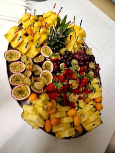 a platter of fruits and vegetables on a table at Ristorante Notari cà di gust vecc in Malvaglia