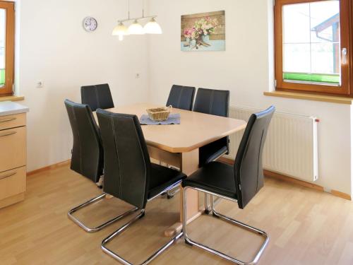 a dining room with a table and chairs at Apartment Brix - BRG120 by Interhome in Bruck an der Großglocknerstraße