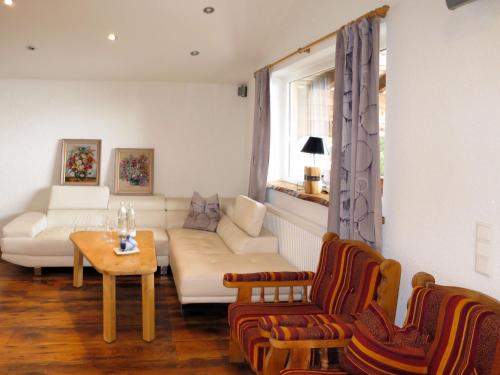 a living room with a couch and a table at Apartment Daniel by Interhome in Hollersbach im Pinzgau
