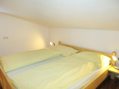 a bedroom with two beds with white sheets at Apartment Daniel by Interhome in Hollersbach im Pinzgau
