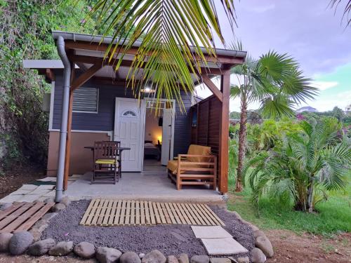 a small house with a porch and a patio at ZimZim in Le Gosier