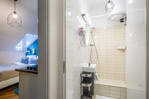 a bathroom with a shower and a sink at Quiet charming apartment near the center in Budapest