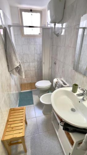 a bathroom with a sink and a toilet at Via Spani 13 in San Pietro Vernotico