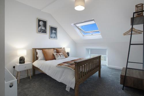 a bedroom with a bed and a skylight at Stylish Home near St Johns Chapel, Sleeps 6 in Saint Johns Chapel