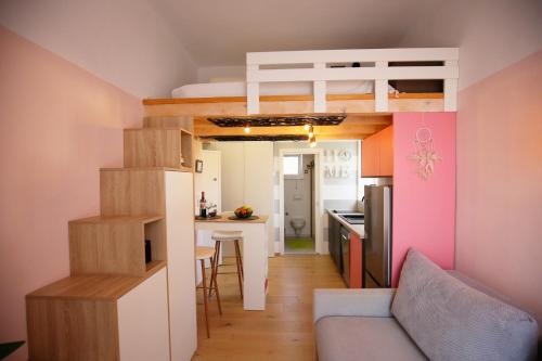 a small apartment with a loft bed and a kitchen at STUDIO MO in Opatija