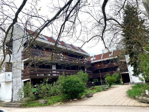 a large building with a courtyard in front of it at Napsugár Retro Apartman in Gárdony