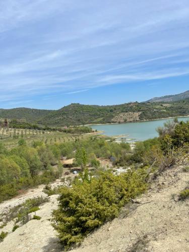 a view of a body of water from a hill at Lake Campground Silvano in Berat