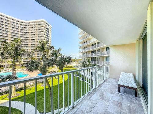 a balcony with a view of a resort at Beach Front Condo In Paradise Marco Island in Marco Island