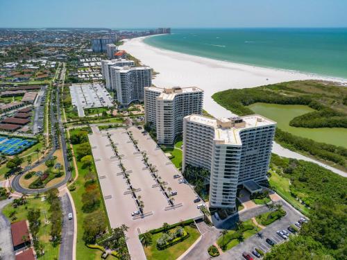 an aerial view of the beach and buildings at Beach Front Condo In Paradise Marco Island in Marco Island
