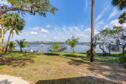 a view of a body of water with palm trees at Waterfront Stuart Oasis with Hot Tub and Dock! in Stuart