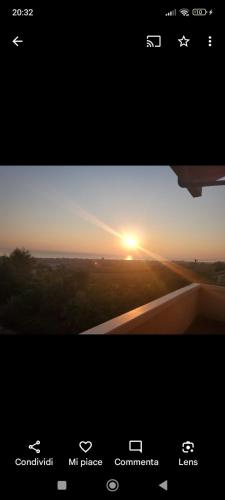 a view of a sunset from a cell phone screen at B&B Villa Alma in San Costanzo
