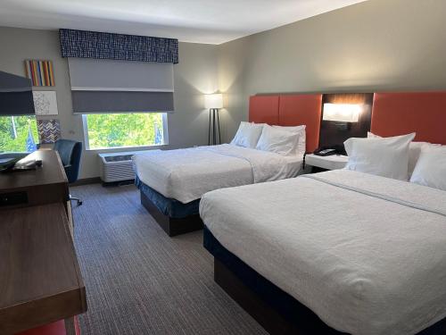 a hotel room with two beds and a window at Hampton Inn & Suites Tallahassee I-10-Thomasville Road in Tallahassee
