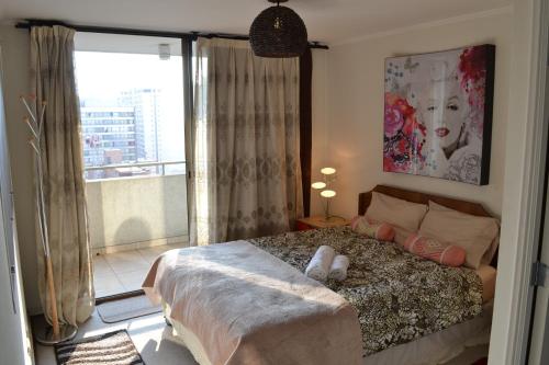 A bed or beds in a room at Departamento en Santiago Centro